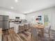 Charming kitchen with an island, stainless steel appliances and adjacent dining area, perfect for entertaining at 125 Fosters Glen Pl, Mooresville, NC 28115
