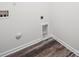 The laundry room features wood-look floors, utility connections, and white trim at 125 Fosters Glen Pl, Mooresville, NC 28115