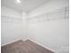 Spacious walk-in closet, offering ample storage with shelving, perfect for organizing your wardrobe and accessories at 125 Fosters Glen Pl, Mooresville, NC 28115