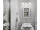 Small bathroom featuring modern vanity and a decorative mirror at 131 Cherry Bark Dr, Mooresville, NC 28117