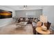 Cozy bonus room with leather sectional, TV, and natural light at 131 Cherry Bark Dr, Mooresville, NC 28117
