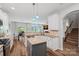 Beautiful kitchen with granite countertops, a center island, and an adjacent dining area at 131 Cherry Bark Dr, Mooresville, NC 28117