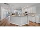 Open-concept kitchen featuring a breakfast bar, granite counters, and stainless steel appliances at 131 Cherry Bark Dr, Mooresville, NC 28117