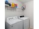 Well-lit laundry room featuring a side-by-side washer and dryer at 131 Cherry Bark Dr, Mooresville, NC 28117