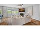 Spacious living room features hardwood floors, fireplace, large sectional sofa, and lots of natural light at 131 Cherry Bark Dr, Mooresville, NC 28117
