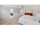Spacious main bedroom featuring neutral tones, a ceiling fan, and an ensuite bathroom at 131 Cherry Bark Dr, Mooresville, NC 28117