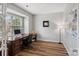 Well-lit home office with a large desk, comfortable chair, and ample natural light at 131 Cherry Bark Dr, Mooresville, NC 28117