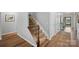 Staircase with wood railing and carpeted steps leading to the upper level of the home at 131 Cherry Bark Dr, Mooresville, NC 28117