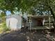 Backyard with a covered carport and ramp, offering practical convenience and accessibility at 1317 Moretz Ave, Charlotte, NC 28206