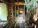 Bare home interior stripped to studs, revealing raw structure and renovation potential at 1317 Moretz Ave, Charlotte, NC 28206