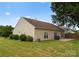 View of the home's backyard showing grass, a patio, shrubs, and the exterior at 133 Fontanelle Dr, Mooresville, NC 28115