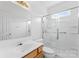 Bathroom boasts a wood vanity, toilet, and shower with glass doors at 133 Fontanelle Dr, Mooresville, NC 28115