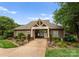 Community entrance with manicured landscaping and decorative signage at 133 Fontanelle Dr, Mooresville, NC 28115