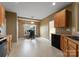 Eat-in kitchen area with desk and work space plus view to traditional cabinetry and appliances at 133 Fontanelle Dr, Mooresville, NC 28115