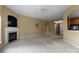 Bright living space with neutral carpet, fireplace, and views into the entry and kitchen at 133 Fontanelle Dr, Mooresville, NC 28115