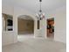 Spacious living room with large archway, fireplace, and seamless flow into the kitchen at 133 Fontanelle Dr, Mooresville, NC 28115