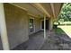 Covered back porch with flagstone flooring and a brick exterior with multiple entry points at 157 Blackberry Ln, Taylorsville, NC 28681
