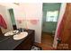 Cozy bathroom featuring a single sink vanity, large mirror and combination shower with toilet at 157 Blackberry Ln, Taylorsville, NC 28681