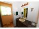 Charming bathroom featuring a dark vanity, single sink, and decorative lighting fixture at 157 Blackberry Ln, Taylorsville, NC 28681
