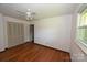 Bright bedroom with hardwood floors, ceiling fan, double closet and natural light from the window at 157 Blackberry Ln, Taylorsville, NC 28681