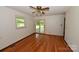 Inviting bedroom featuring hardwood floors, window, and glass sliding doors leading to an outdoor space at 157 Blackberry Ln, Taylorsville, NC 28681