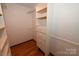 Well-organized walk-in closet with adjustable shelves, drawers, and hanging rods at 157 Blackberry Ln, Taylorsville, NC 28681