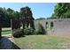 Brick courtyard featuring arched openings and lush green landscaping at 157 Blackberry Ln, Taylorsville, NC 28681