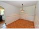 Dining room with neutral walls and vintage chandelier at 157 Blackberry Ln, Taylorsville, NC 28681