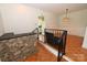 Open dining room with hardwood floors, stairs, and a kitchen view for seamless dining experiences at 157 Blackberry Ln, Taylorsville, NC 28681