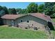 Elevated exterior view of brick ranch home with red shingle roof, and large backyard at 157 Blackberry Ln, Taylorsville, NC 28681