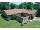 Charming brick home featuring an attached two-car garage and unique brick courtyard walls and a spacious lawn at 157 Blackberry Ln, Taylorsville, NC 28681
