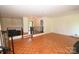 Spacious living room with hardwood floors, a ceiling fan, fireplace, and great flow for entertaining at 157 Blackberry Ln, Taylorsville, NC 28681