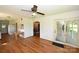 Inviting living room with wood floors, ceiling fan, and access to the backyard and kitchen at 157 Blackberry Ln, Taylorsville, NC 28681