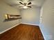 Dining area with hardwood style floors and convenient pass-through to the kitchen at 1600 Sharon W Rd # 16, Charlotte, NC 28210