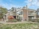 Charming multi-level townhouse with brick accents, balconies, and mature landscaping at 1600 Sharon W Rd # 16, Charlotte, NC 28210
