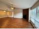 Bright living area with fireplace, ceiling fan, and large windows at 1600 Sharon W Rd # 16, Charlotte, NC 28210