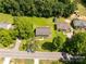 A birds-eye view of the home and the large green backyard and surrounding mature trees at 1675 Old Lynwood Cir, Lancaster, SC 29720