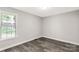 Neutral bedroom features gray walls, modern vinyl floors, and bright natural light at 1675 Old Lynwood Cir, Lancaster, SC 29720