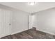 Neutral bedroom boasts spacious closet, updated flooring, and recessed lighting at 1675 Old Lynwood Cir, Lancaster, SC 29720