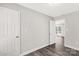 Bedroom featuring luxury vinyl plank flooring, neutral paint, and white doors at 1675 Old Lynwood Cir, Lancaster, SC 29720