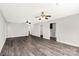 Spacious living room featuring modern flooring, ceiling fans, and fresh neutral paint at 1675 Old Lynwood Cir, Lancaster, SC 29720
