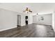 Spacious living room featuring modern flooring, ceiling fans, and fresh neutral paint at 1675 Old Lynwood Cir, Lancaster, SC 29720