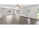 Bright living room with large windows, modern flooring, ceiling fans, and neutral paint at 1675 Old Lynwood Cir, Lancaster, SC 29720