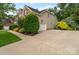 Home with an attached garage, long driveway and beautiful landscaping at 1812 Mill Chase Ln, Waxhaw, NC 28173