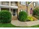 Close-up of a home's front entrance showcasing neat landscaping and a welcoming, classic-style door at 1812 Mill Chase Ln, Waxhaw, NC 28173