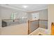 Spacious hallway with beautiful railings and trim, leading to other areas of the home at 1812 Mill Chase Ln, Waxhaw, NC 28173