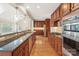 Modern kitchen featuring stainless steel appliances, ample cabinet space, and hardwood flooring at 1812 Mill Chase Ln, Waxhaw, NC 28173