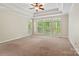 Spacious main bedroom featuring a tray ceiling, large windows, and natural light at 1812 Mill Chase Ln, Waxhaw, NC 28173