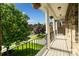 Inviting porch with classic columns and black railing overlooking the landscaped front yard at 1812 Mill Chase Ln, Waxhaw, NC 28173