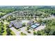 Aerial view of the community featuring a clubhouse, pool, tennis courts and manicured landscaping at 18236 Coulter Pkwy, Cornelius, NC 28031